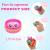 A pink squishy toy shaped like a donut is shown with measurements and demonstration of its squeeze and rebound features.
