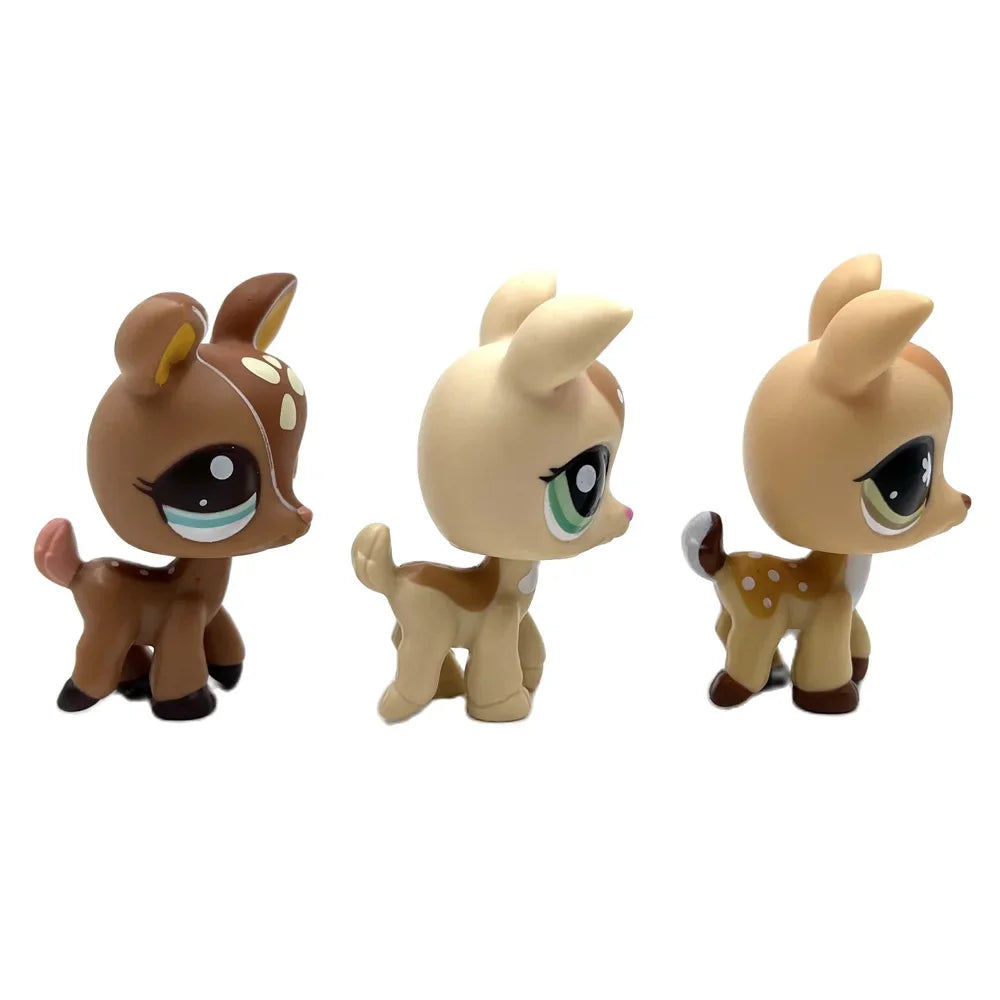 A set of three Bobbing Deer bobblehead toys in brown and tan colors.