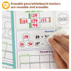 A hand uses an erasable pen to write numbers on a maths learning chart for kids.