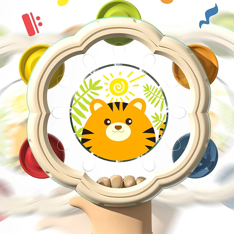A hand drum and shake rattle set for toddlers is displayed in a decorative frame.