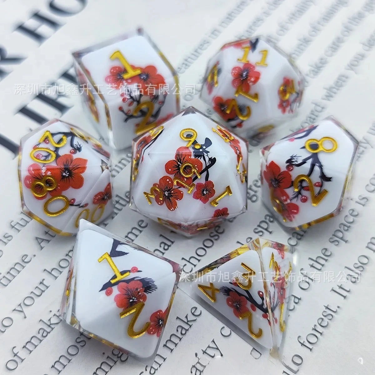 A set of milk white resin dice featuring a black kitten design with red floral accents.