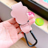A hand holds a pink PU leather stroller organizer hook with a black clip.