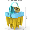 A yellow castle sand play set with a blue bucket and scoop, shown from above.