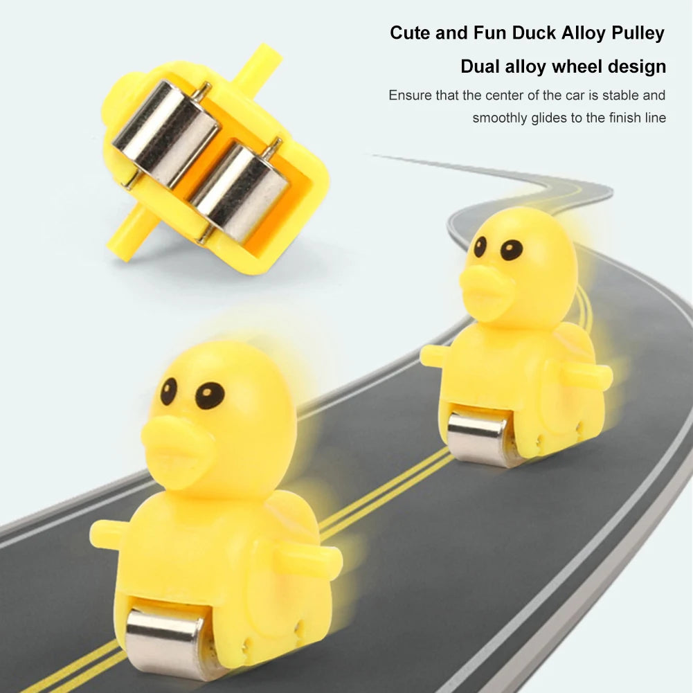 Yellow duck alloy pulley wheel design for an animal racing car toy set on a track.