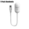 A white 2-in-1 projector night light with an interchangeable filter and a detachable cord.