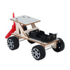 A wooden paddle boat kit with a red paddle and black wheels for a DIY science project.