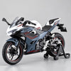 A white and black 1:12 scale Ninja motorcycle diecast model with lights and sound displayed on a gray background.