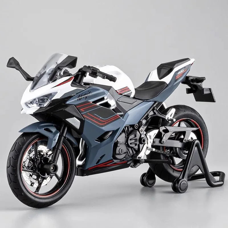 A white and black 1:12 scale Ninja motorcycle diecast model with lights and sound displayed on a gray background.