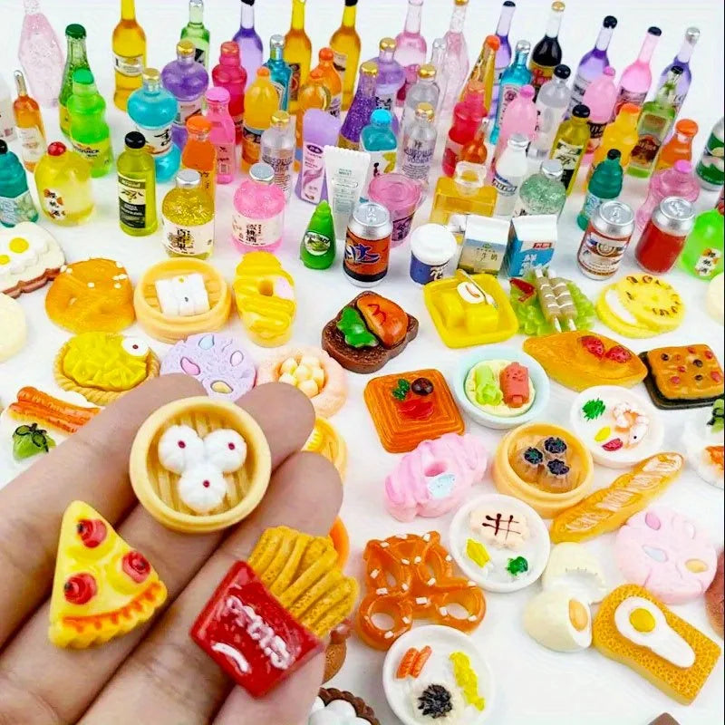 A collection of miniature dollhouse food items including cakes, wine bottles, and various snacks displayed on a hand.