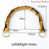A curved resin faux bamboo handle with holes for DIY bag projects.
