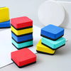A set of five colorful red, yellow, blue, and cyan felt pads used as magnetic whiteboard erasers.
