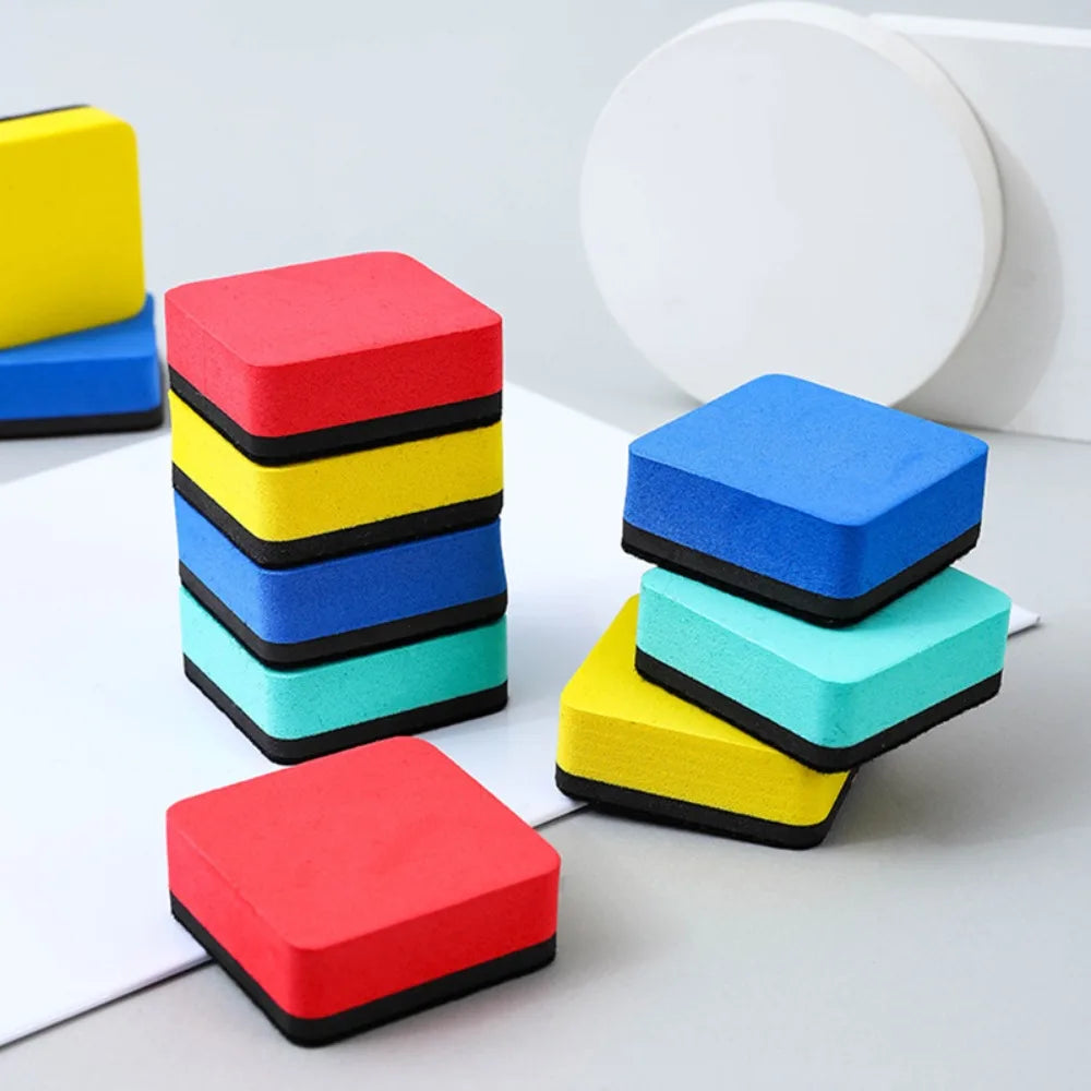 A set of five colorful red, yellow, blue, and cyan felt pads used as magnetic whiteboard erasers.