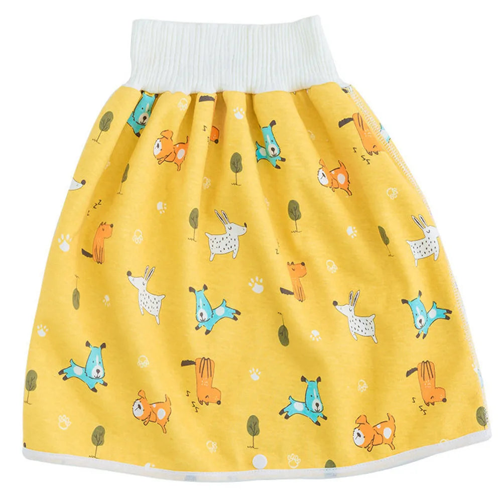 Yellow waterproof baby diaper pants with a skirt featuring small orange and blue animal patterns.