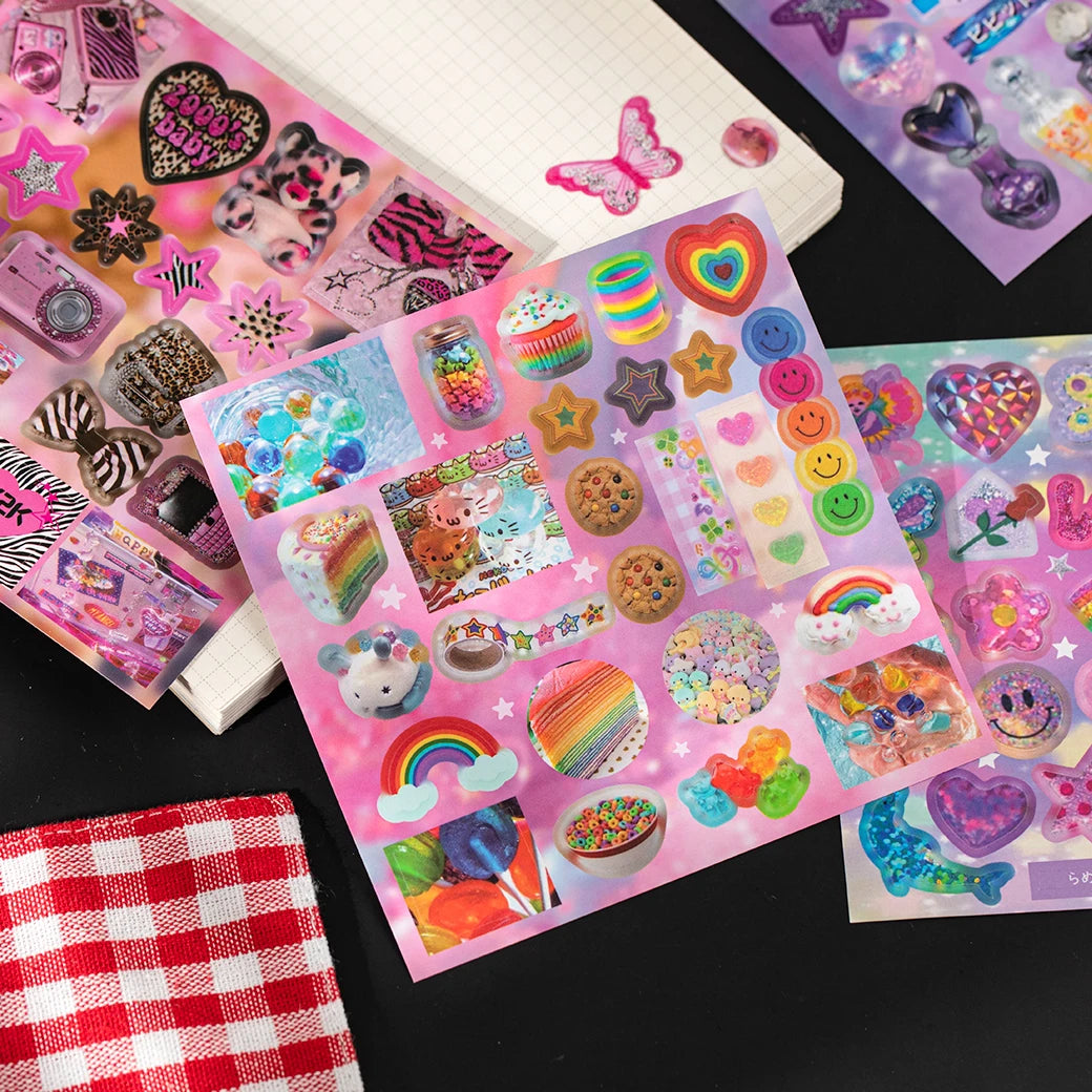 A collection of colorful die-cut stickers featuring cute and vintage designs on a sheet of paper.