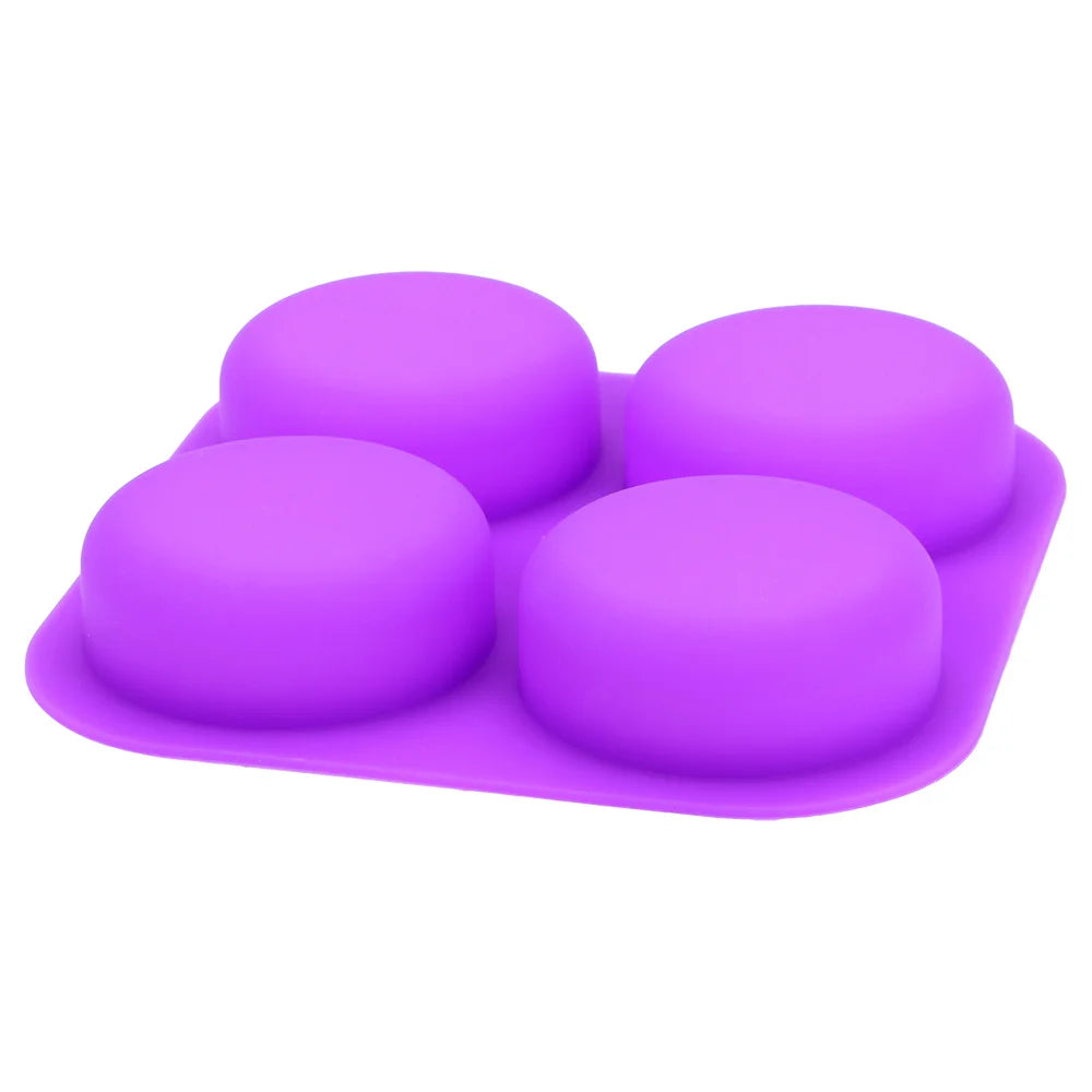 A purple reusable silicone soap mold with four cavities is shown from above.