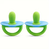 A pair of green silicone teething rings with a textured nipple and blue silicone bases.