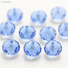A collection of round, faceted blue crystal glass beads used for jewelry making.