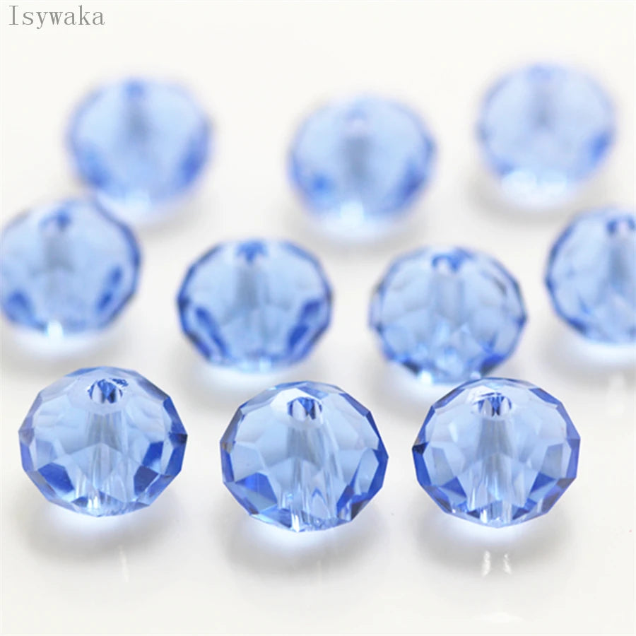 A collection of round, faceted blue crystal glass beads used for jewelry making.