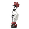 Skeleton hand rose bouquet building kit featuring white skeletal arms and red roses.