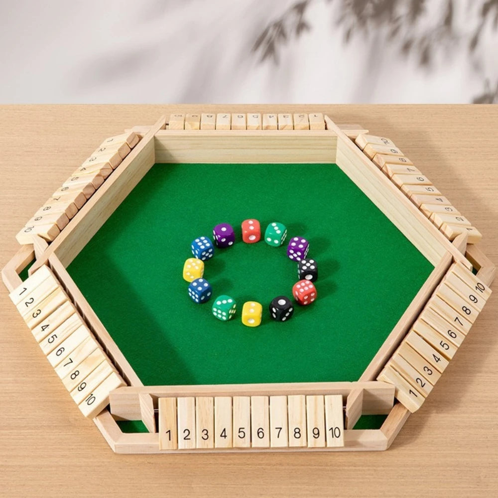 A wooden shut the box dice game with a green board and wooden dice arranged in a hexagonal frame.
