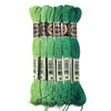A set of six skeins of vibrant green embroidery thread for cross stitch and DIY crafts.