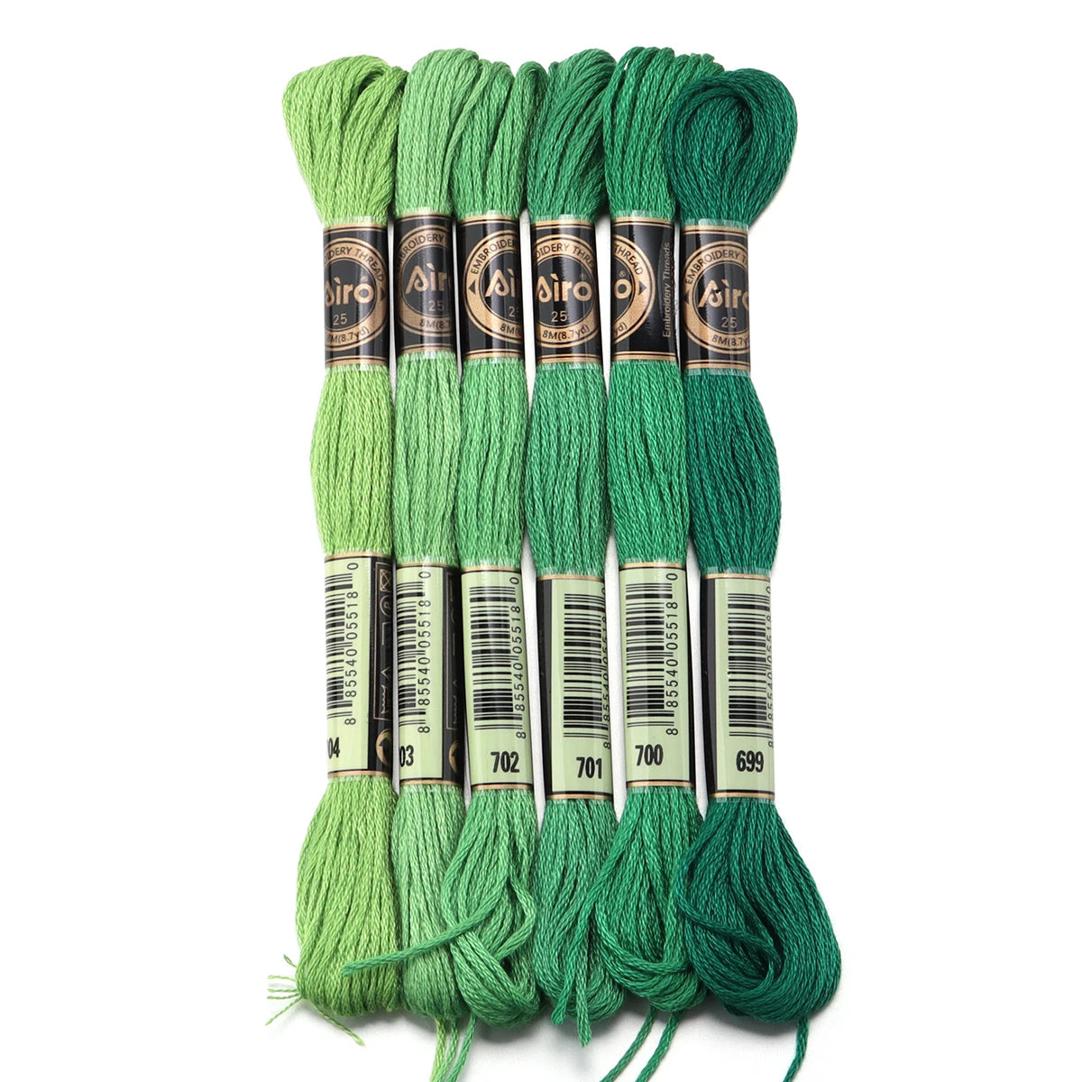 A set of six skeins of vibrant green embroidery thread for cross stitch and DIY crafts.