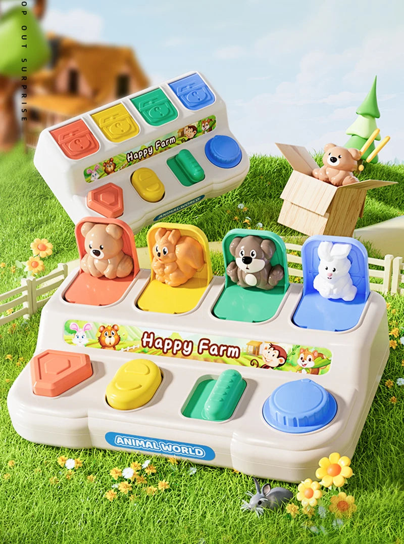 A white Montessori Pop-Up Animal Toy featuring various farm animals in colorful compartments set outdoors on green grass.