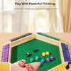 A hand is playing a wooden logic board game with colorful dice on a green felt surface.