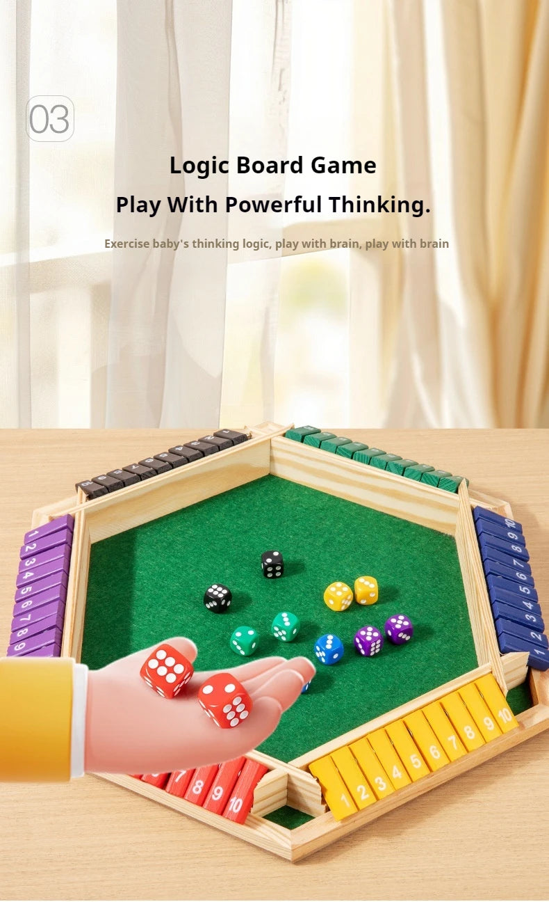 A hand is playing a wooden logic board game with colorful dice on a green felt surface.