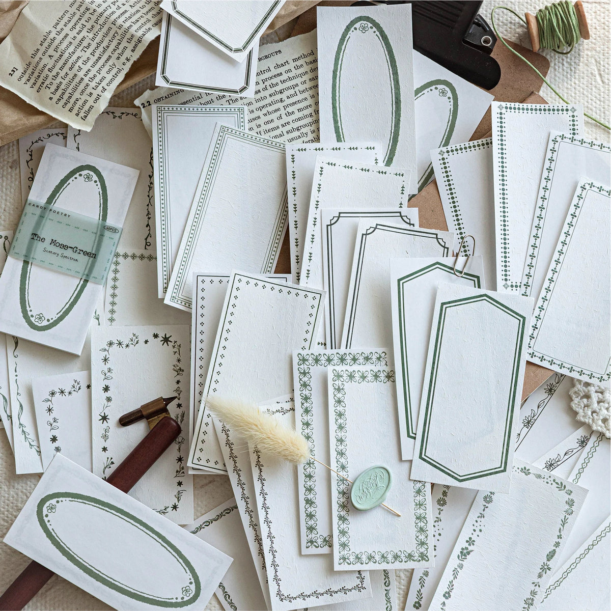 A collection of vintage scrapbooking paper sheets featuring delicate green and white floral patterns for journaling and craft