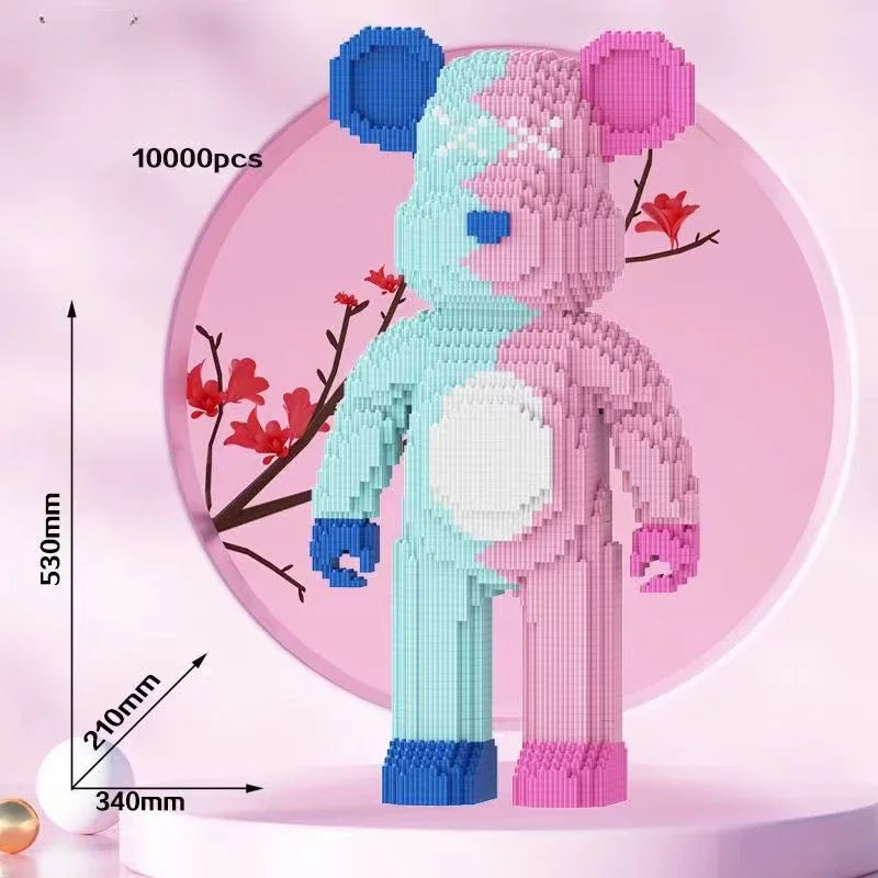A pink and blue bear building block model displayed against a pink background with size measurements.