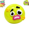 A bright yellow squishy toy shaped like a face with angry, puckered features and a small dog head on top.