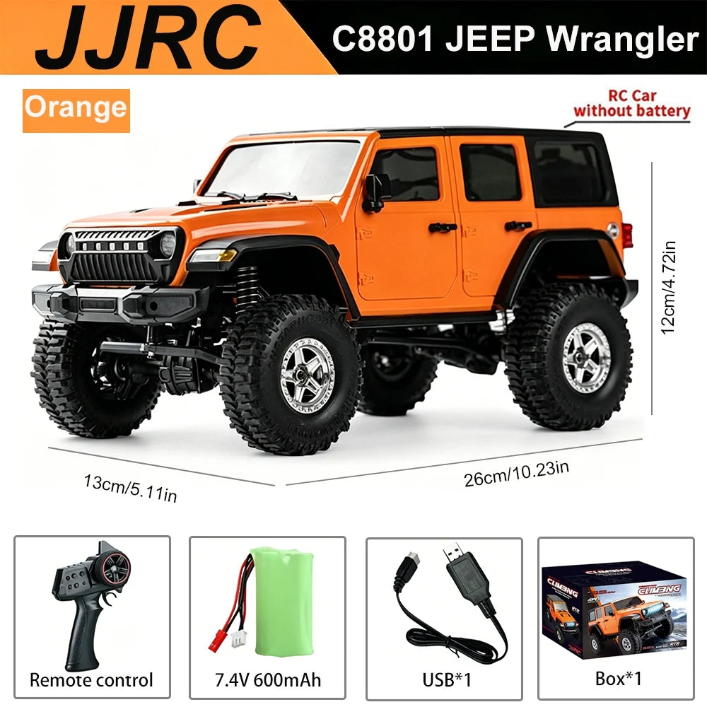 Orange JJRC C8801 Jeep Wrangler RC car with remote control and accessories