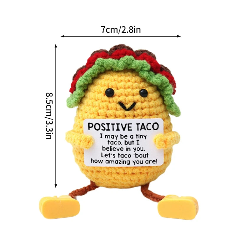 Handmade crochet pocket hug doll shaped like a taco with a positive inspirational message