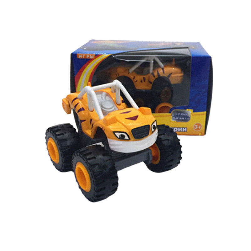 A yellow and black monster truck toy vehicle with large tires is shown in its box.
