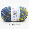 A ball of multi-colored yarn featuring blue, yellow, and green threads labeled as Jane cotton yarn.