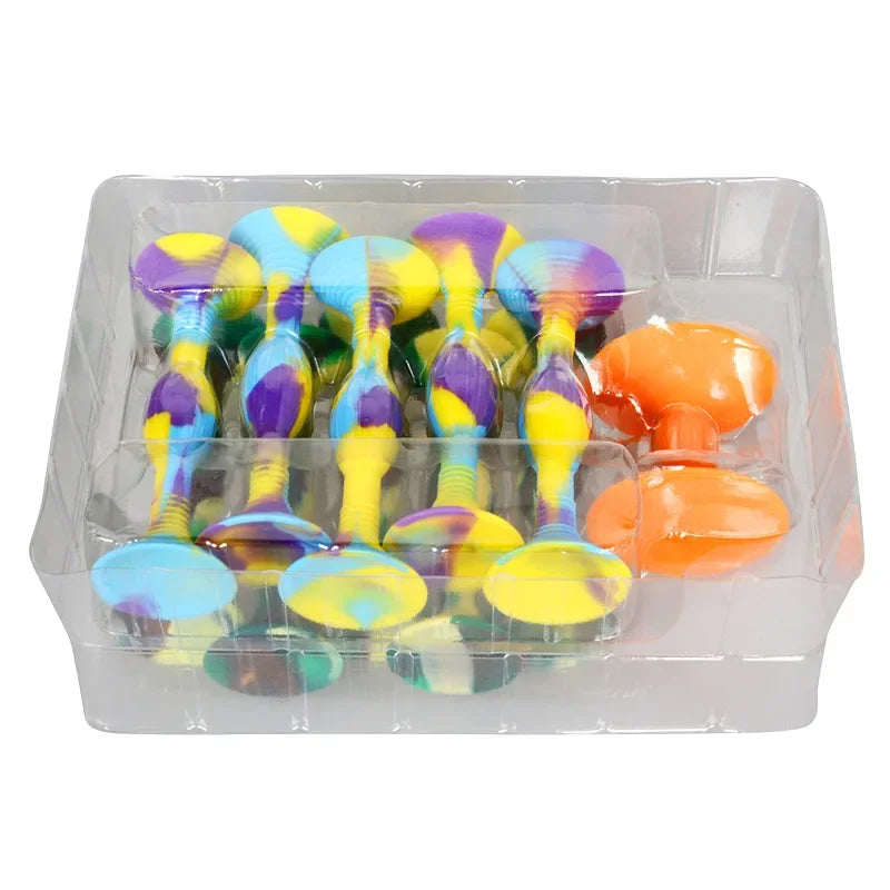 A set of colorful silicone suction cup darts with yellow, purple, and blue tops inside a clear plastic container.