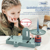 A girl is demonstrating a practical science experiment using a magnetic balance kit to measure the weight of a nut.