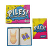 A box and a game set of piles card game featuring colorful cards and packaging.