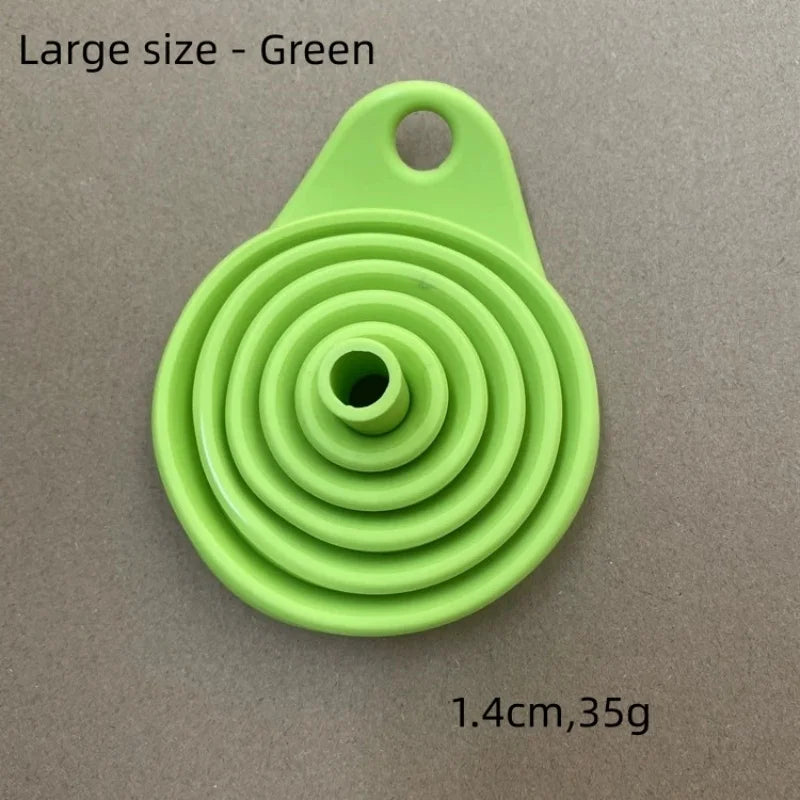 A large green silicone funnel with a handle is shown against a neutral background.