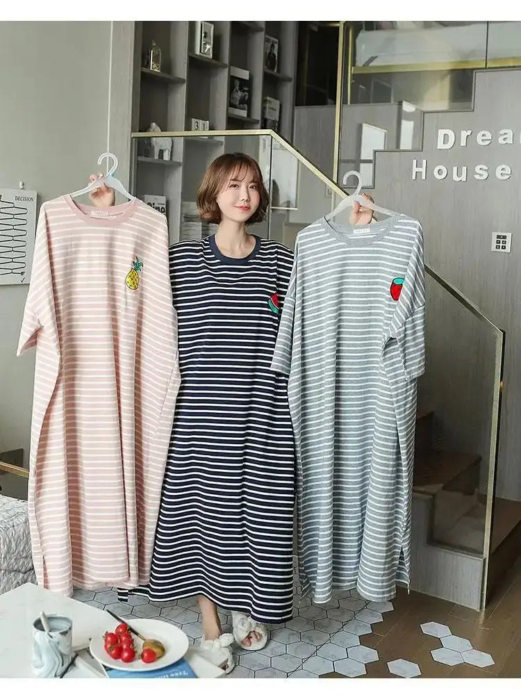 A women's short-sleeve striped lounge dress in pink and white stripes displayed on a hanger.