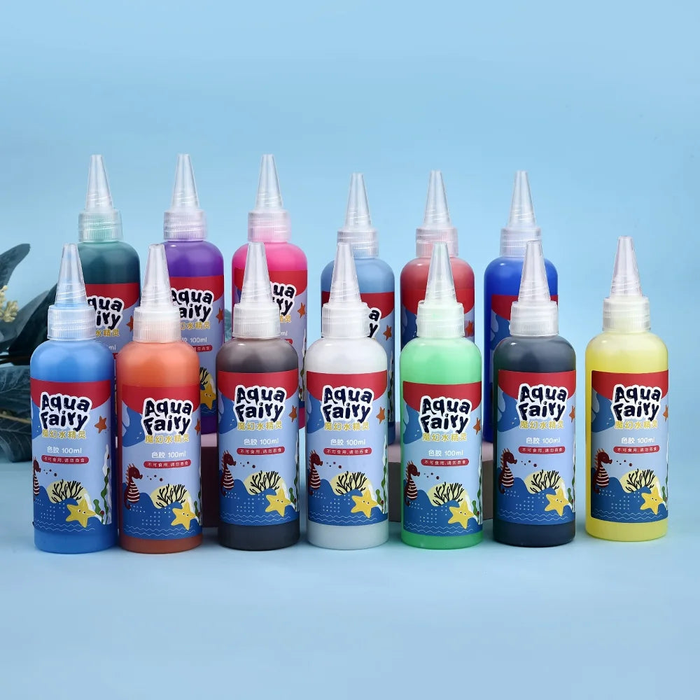 A collection of colorful Aqua Fairy liquid bottles with dropper tops arranged in a row.
