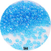 A pile of bright blue Czech glass seed beads for jewelry making