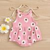 Pink cotton romper for a baby girl with white daisy floral print and adjustable ties