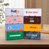 A collection of various colored and branded industrial iron storage boxes lined up on a wooden surface.