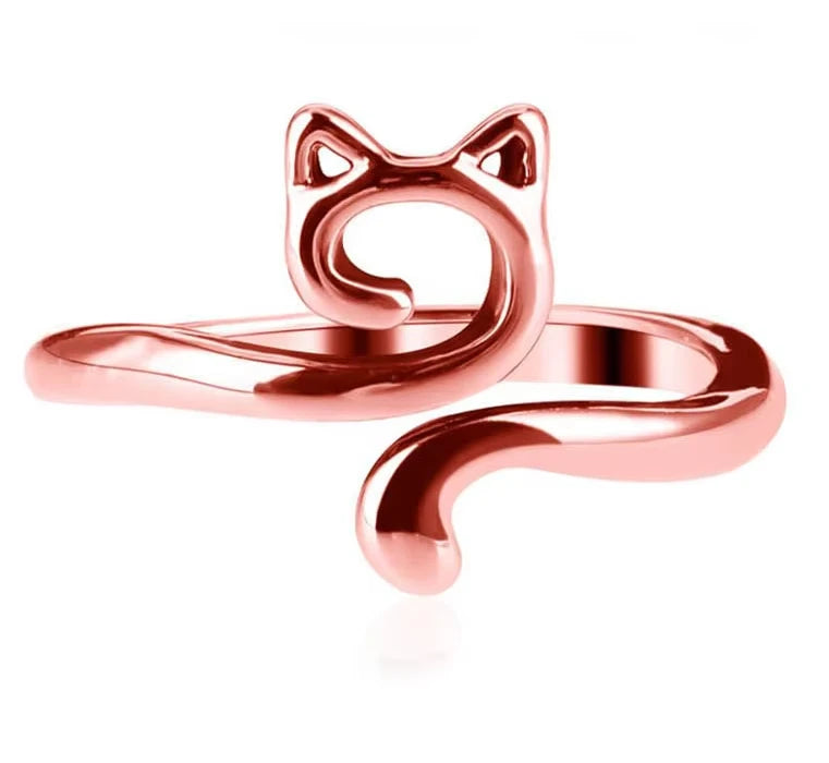 A rose gold adjustable cat-ear yarn guide ring for knitting and crochet.