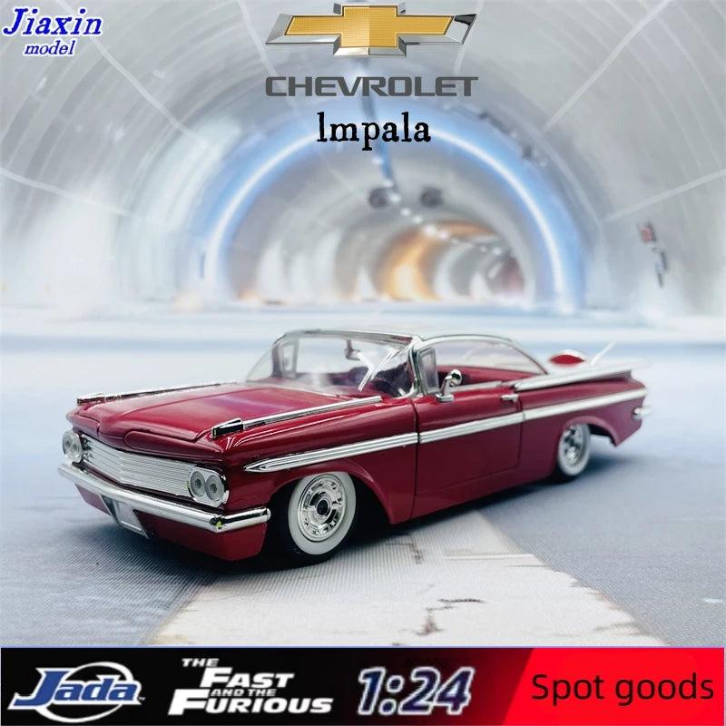 A die-cast model of a red 1959 Chevrolet Impala car in a futuristic tunnel setting.