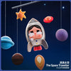 A collectible figurine of a crying astronaut floating in space with various celestial bodies like stars and planets around it