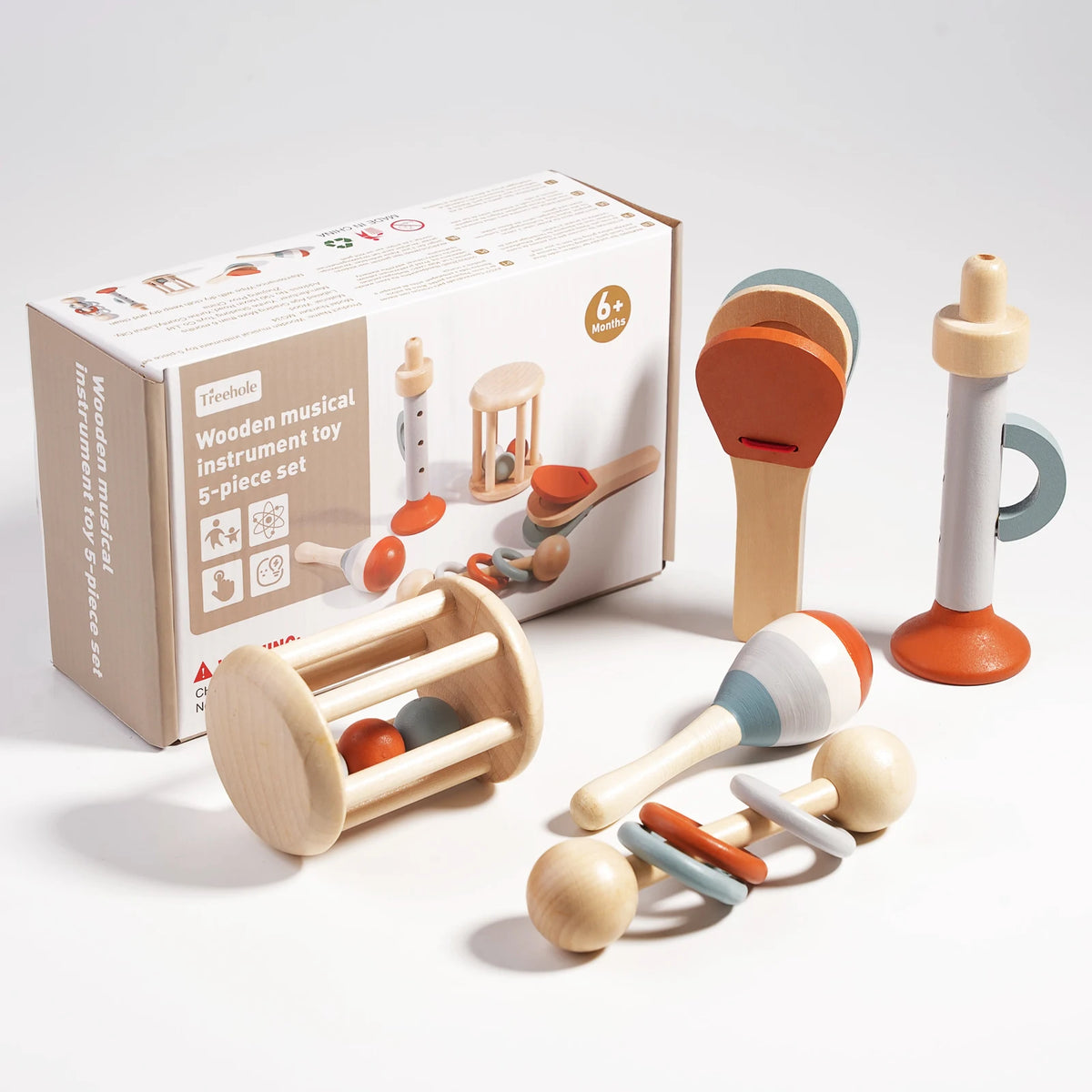 A box of wooden musical instrument toys including a wooden musical instrument toy set for sensory play.