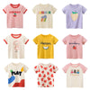 A collection of nine short-sleeve cotton t-shirts for girls featuring various fruit designs like cherry, summer, lemon, melon